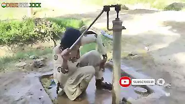 Young village school girl taking a bath in a sari and caught on camera